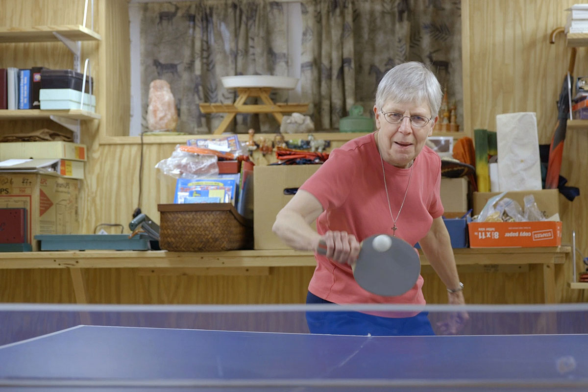 Sister Barbara Schlatter of St. Louis plays table tennis at her home. She participates in a long-term study of adult children of Alzheimer’s patients. The study is led by Washington University School of Medicine in St. Louis.