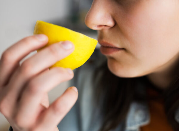 Woman Nose Sniffing Lemon